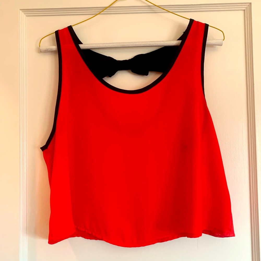 Red tank with black straps.